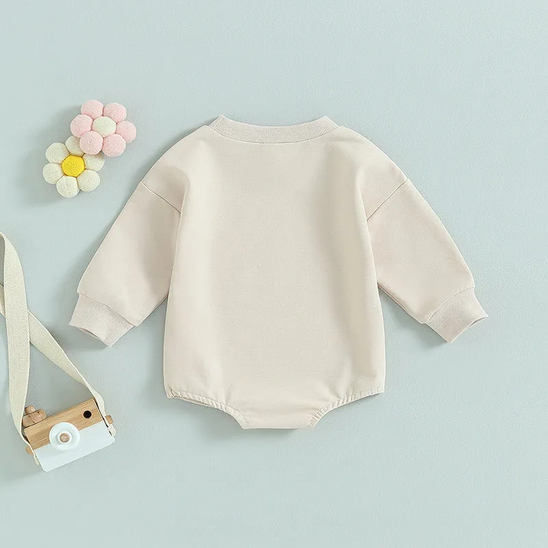 Girls' long-sleeved cotton top with letter flower print in apricot, hide hook closure, front view