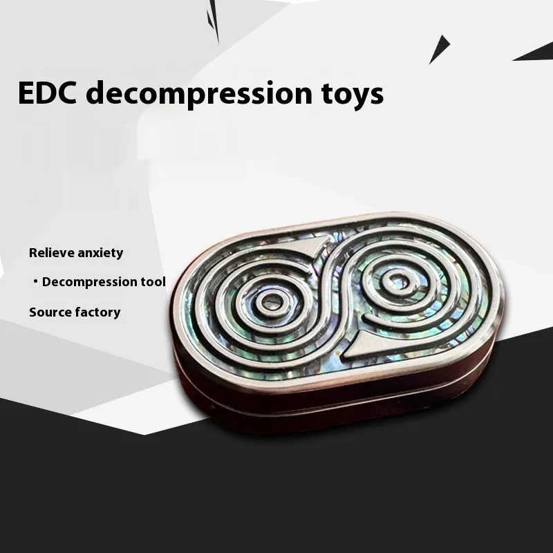 Stainless steel EDC hand push coin in agate red colour on plain background