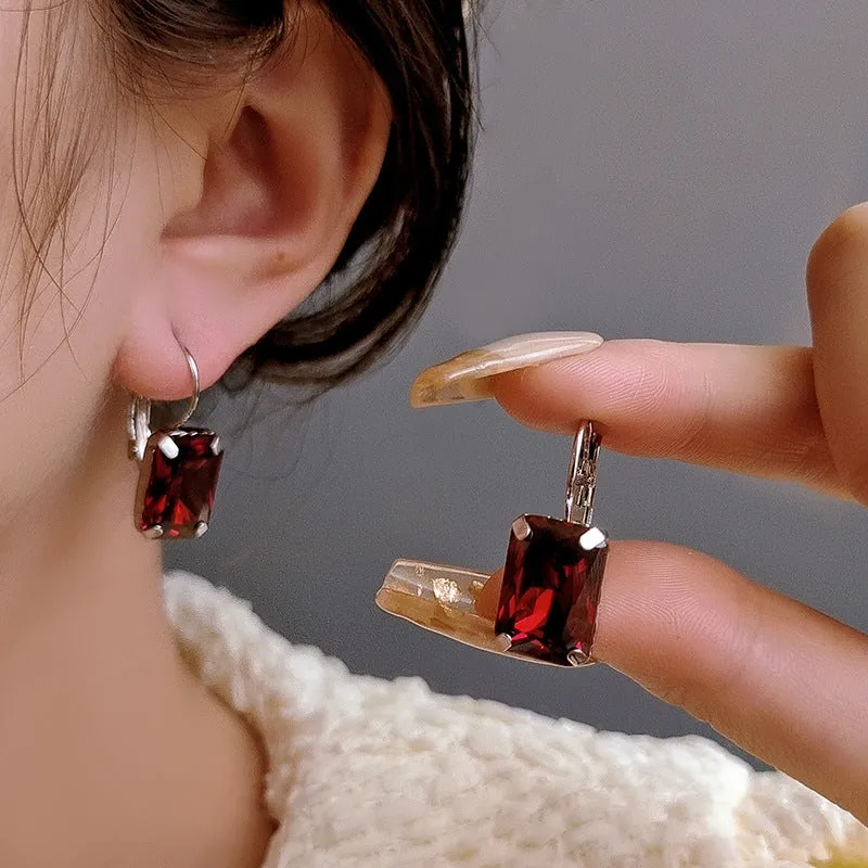 Square crystal fashion earrings in copper with red, yellow, and purple colour options