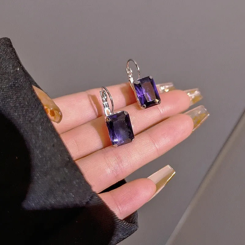 Square crystal fashion earrings in copper with red, yellow, and purple colour options