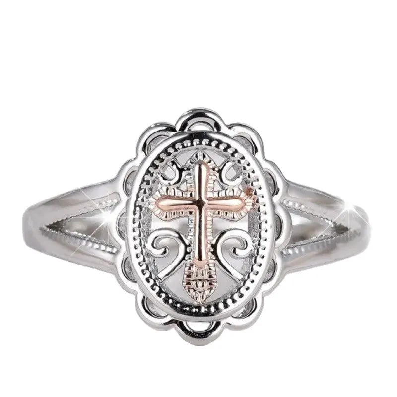 Silver cross and lace patterned alloy ring for women on a white background.