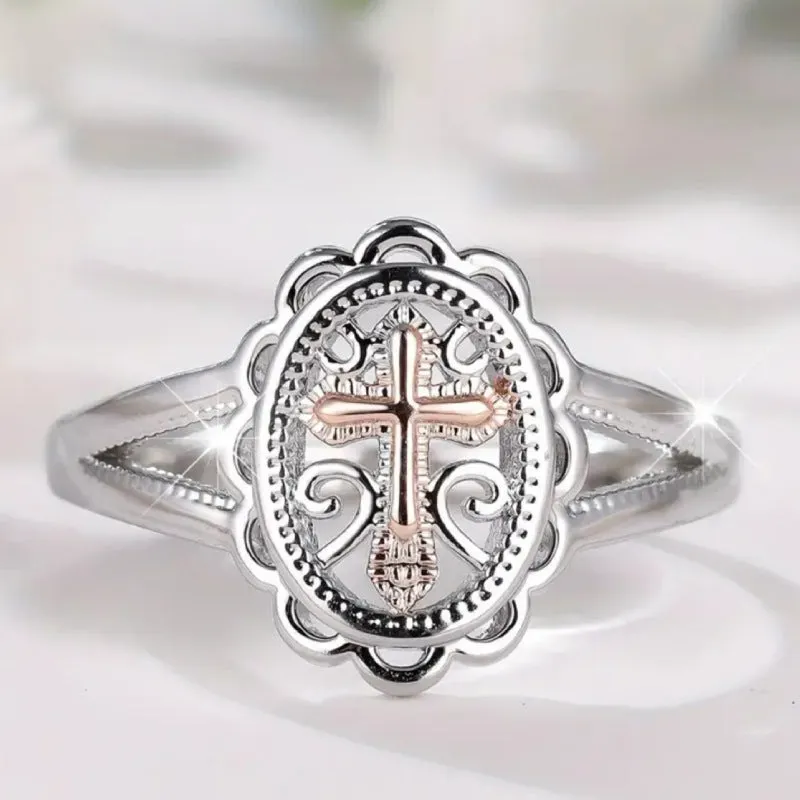 Silver cross and lace patterned alloy ring for women on a white background.