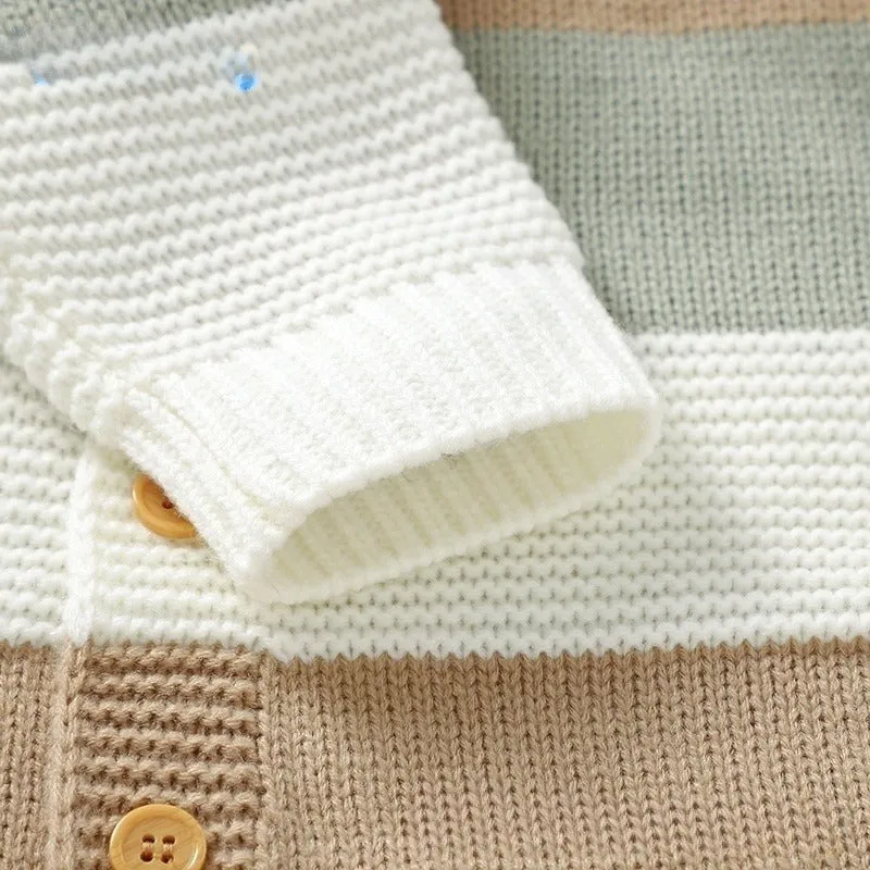 Knitted one-piece baby romper jumpsuit in white with single-breasted front closure and long sleeves