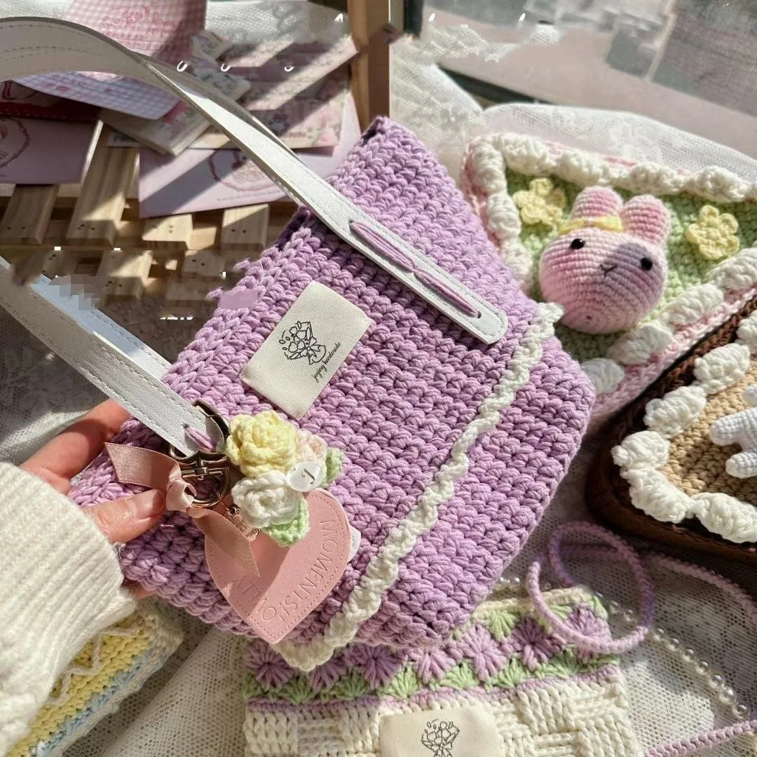 Wool crocheted bear shoulder bag with wooden handle and adjustable strap in one of four decorative styles