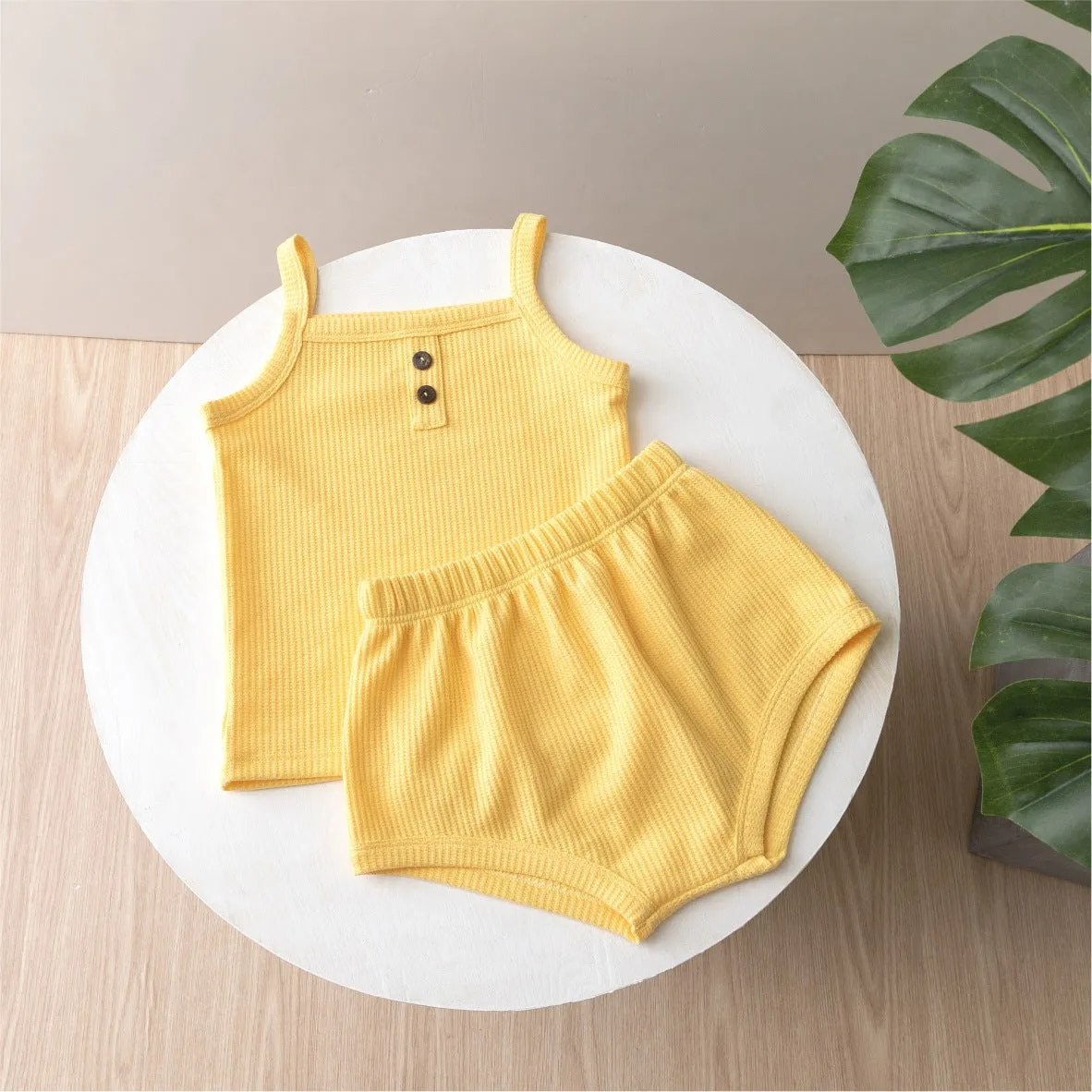Summer baby camisole set with short sleeves and matching shorts in light yellow cotton fabric
