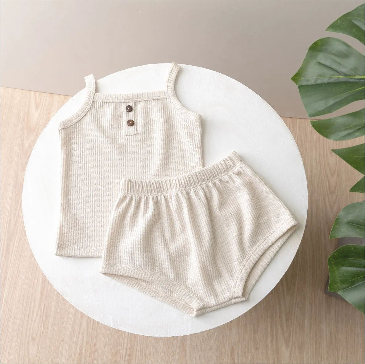 Summer baby camisole set with short sleeves and matching shorts in light yellow cotton fabric