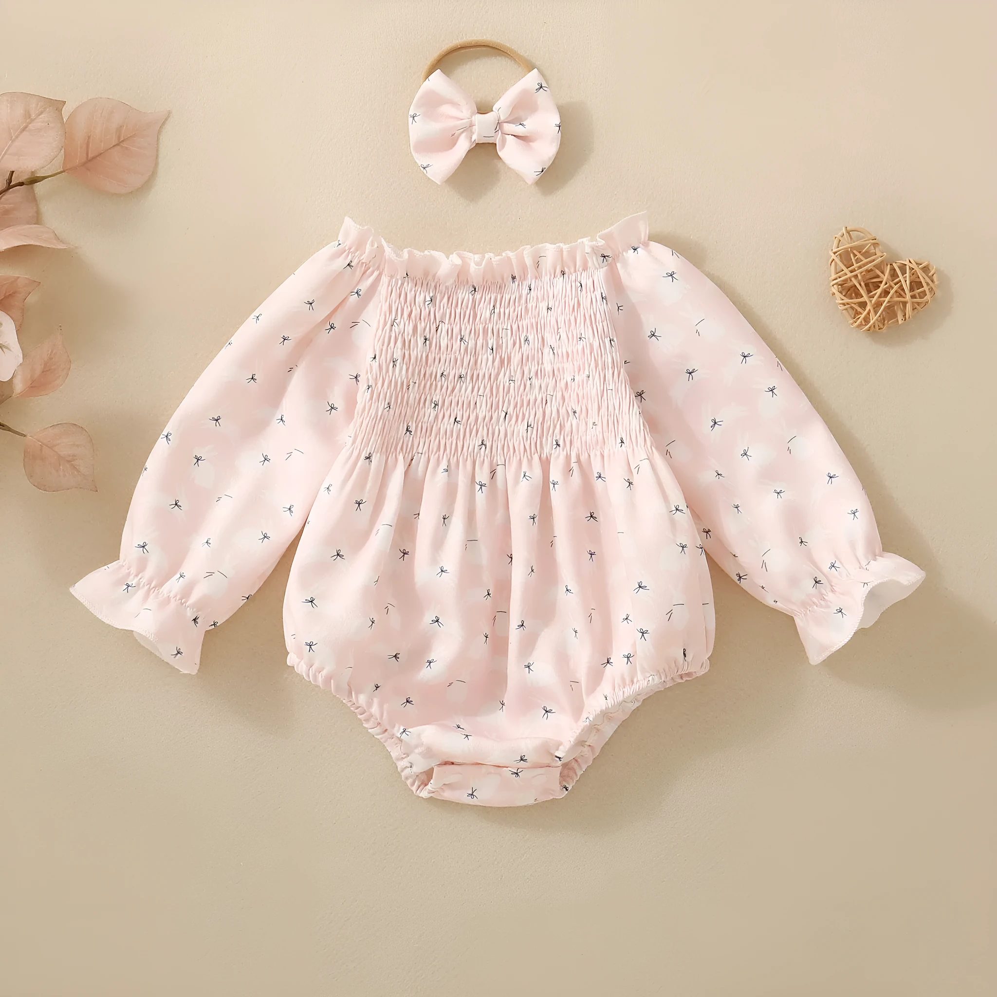 Pink infant cotton long sleeve romper with smocking and print on front for newborn baby girl