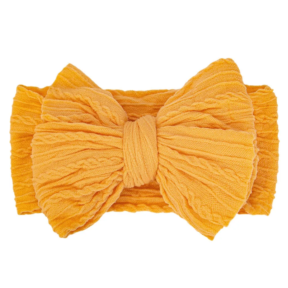 Handmade stretchy nylon baby headband with bow on newborn girl