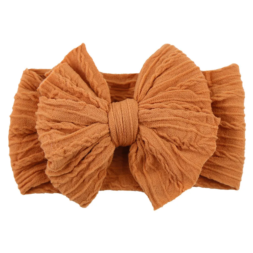 Handmade stretchy nylon baby headband with bow on newborn girl