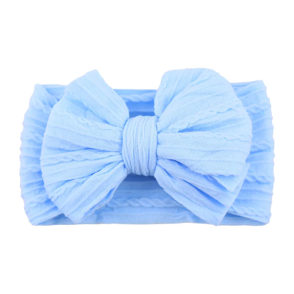 Handmade stretchy nylon baby headband with bow on newborn girl