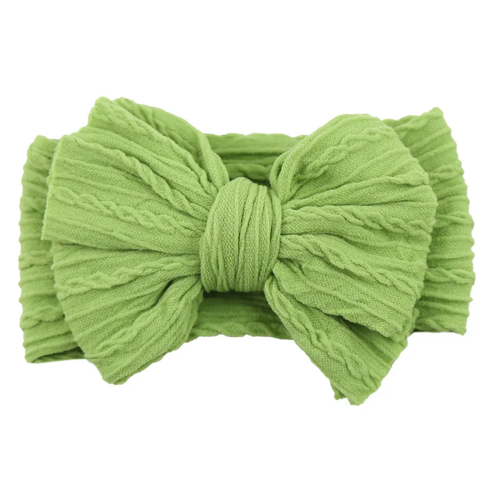 Handmade stretchy nylon baby headband with bow on newborn girl