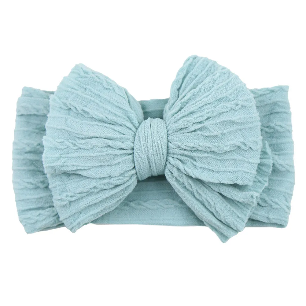 Handmade stretchy nylon baby headband with bow on newborn girl