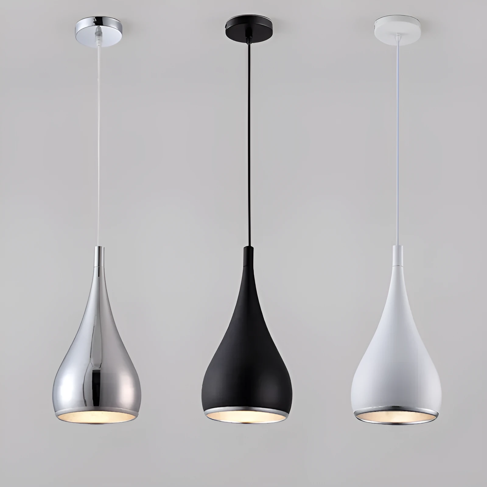 Minimalist black iron chandelier bedside lamp with three adjustable heads on a long platter.