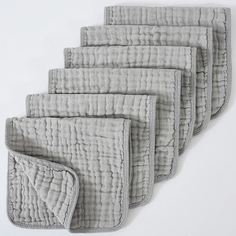 Set of six large muslin burp cloths 25x50cm in assorted colours on white background