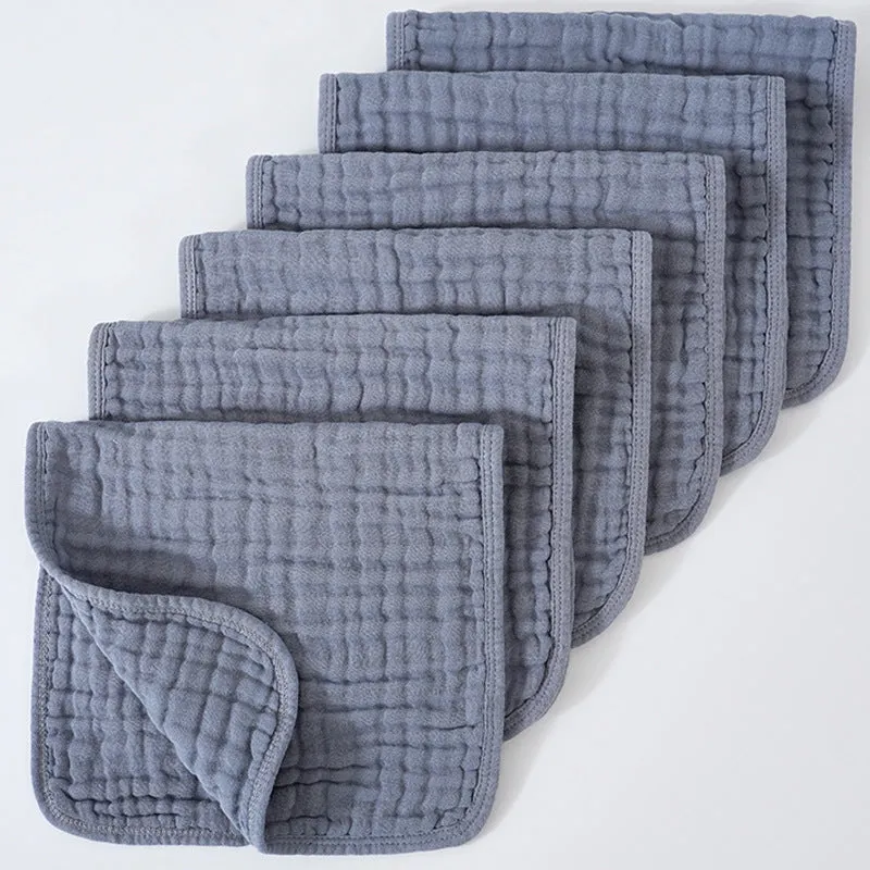 Set of six large muslin burp cloths 25x50cm in assorted colours on white background