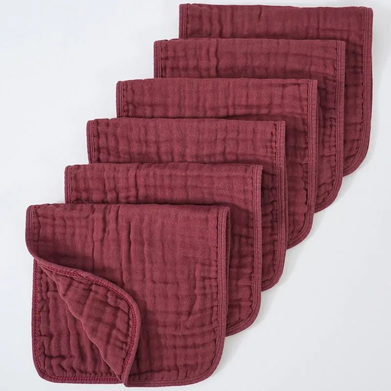 Set of six large muslin burp cloths 25x50cm in assorted colours on white background