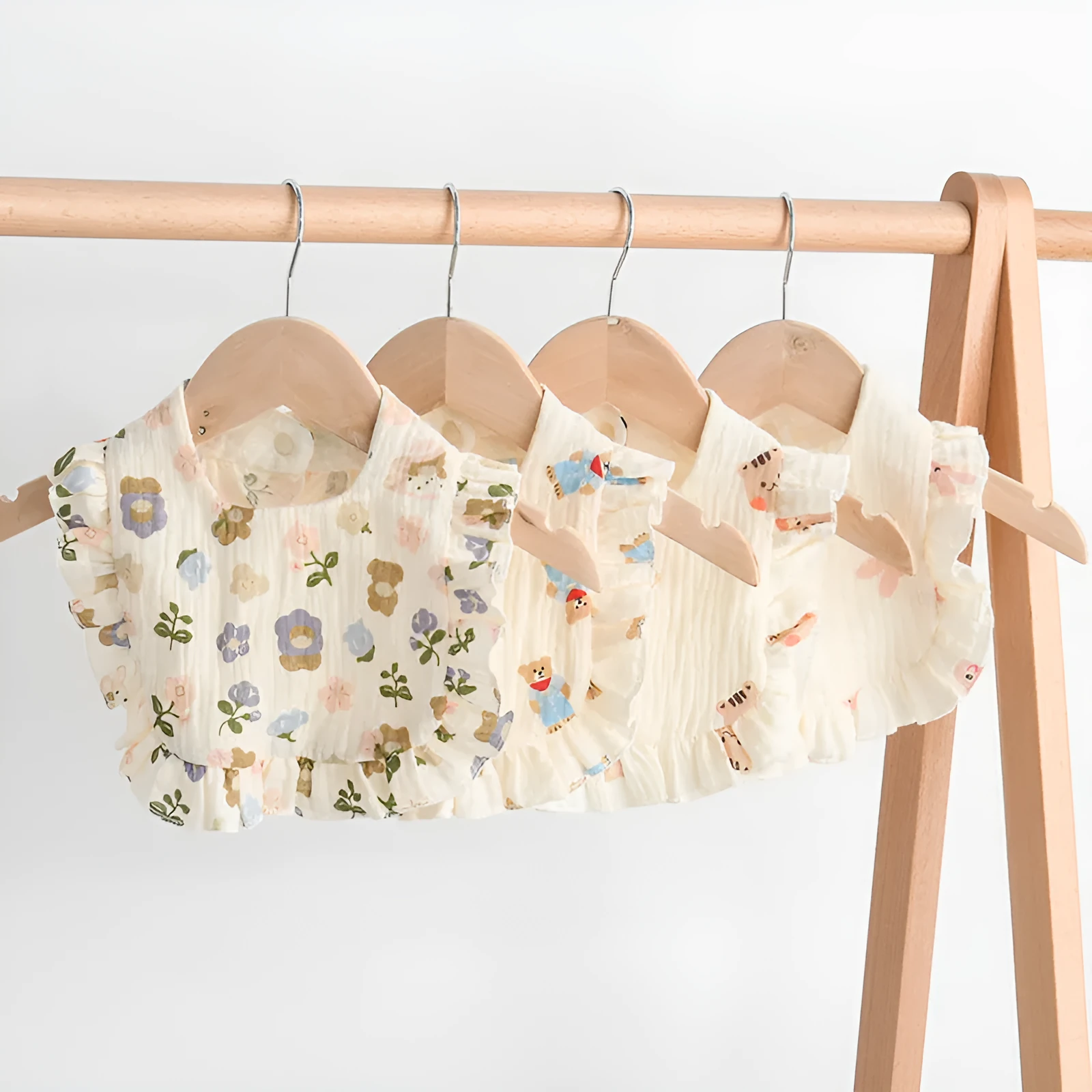 Pack of six baby muslin bibs with animal bandana prints and adjustable snap fasteners