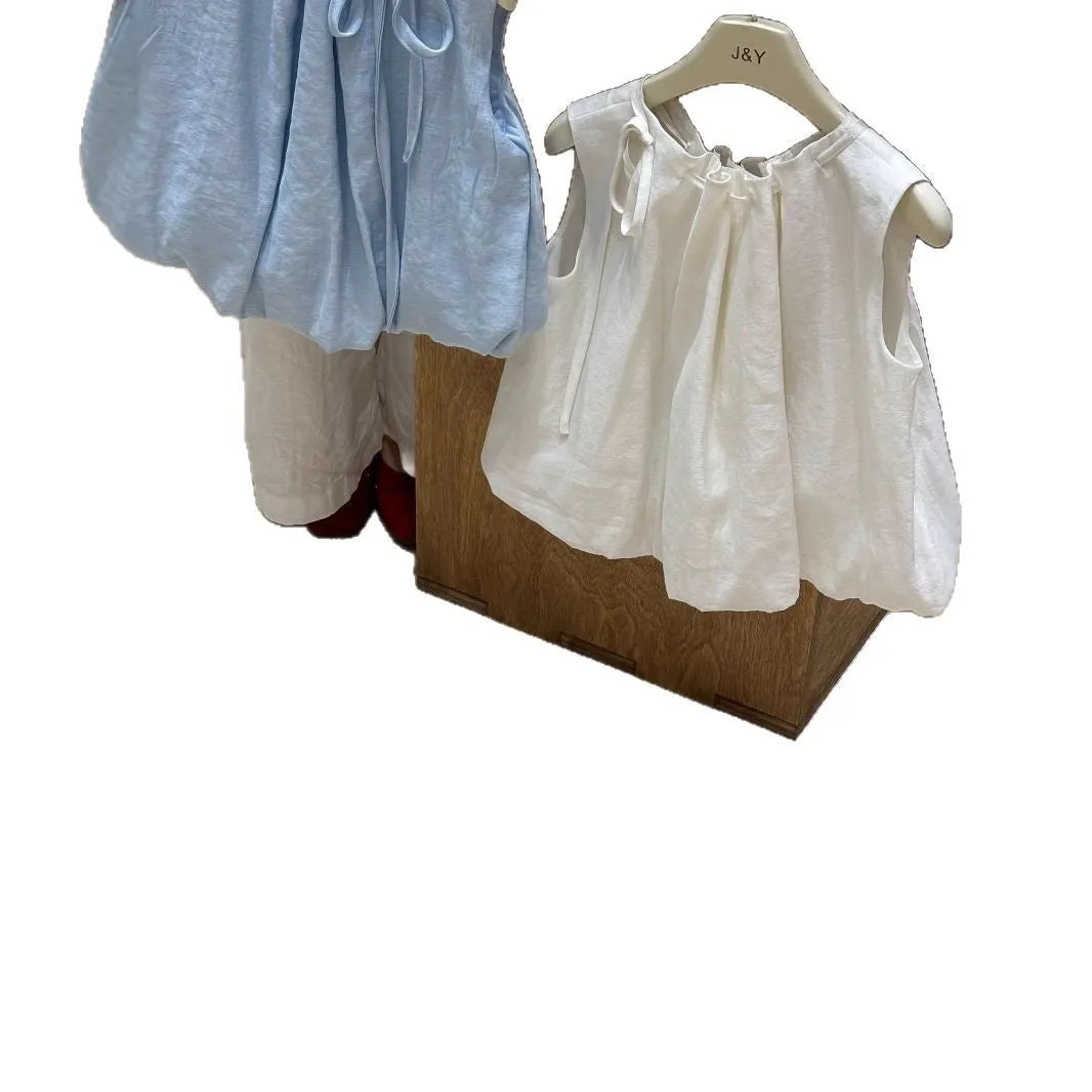 Milky white Korean style cotton drawstring shirt for girls with sleeveless design on light background