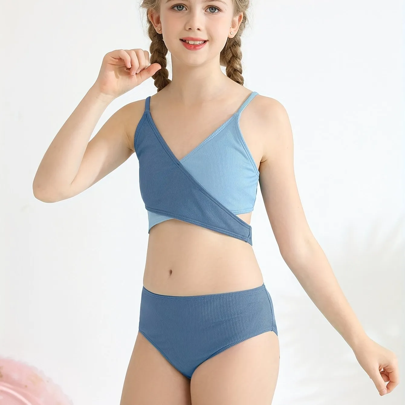 Girls two-piece criss-cross swimsuit set in blue green with polypropylene fabric