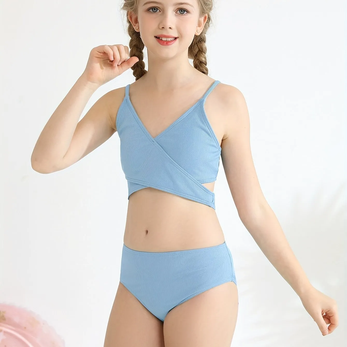 Girls two-piece criss-cross swimsuit set in blue green with polypropylene fabric