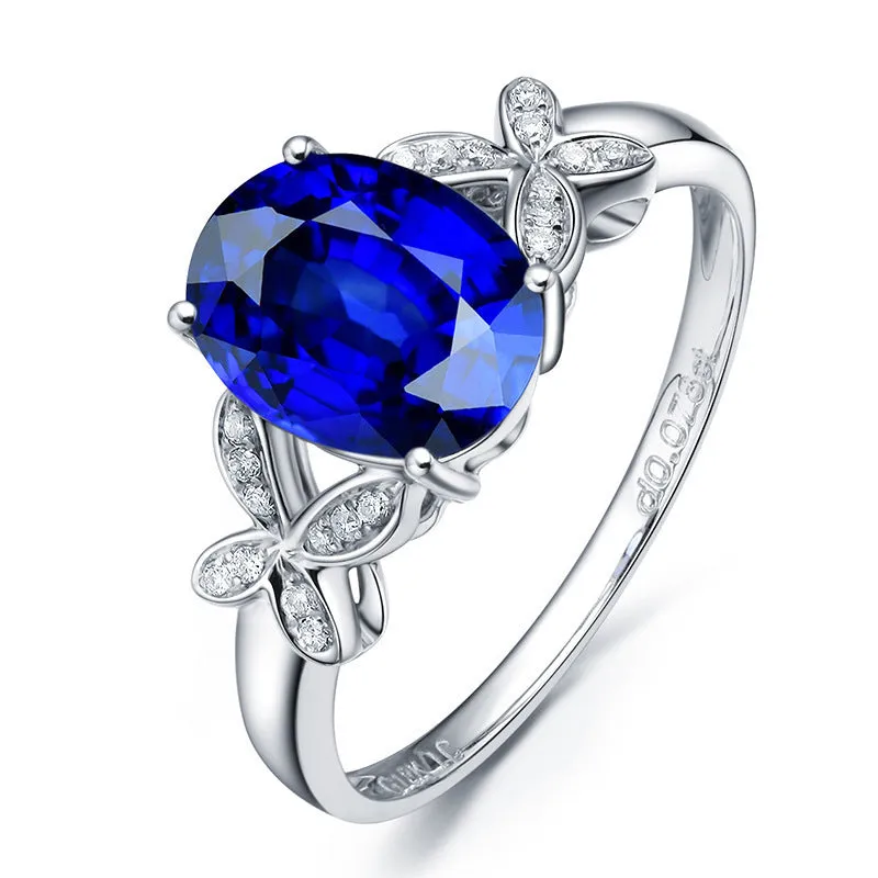 Women's butterfly ring with heart-shaped design in copper and rose gold plating, showing blue and red colour options
