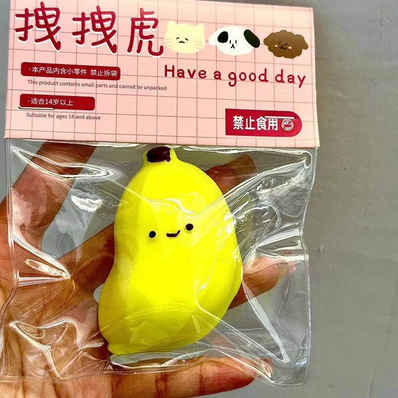 Chubby banana squeezing toy in pink TPR material for stress relief