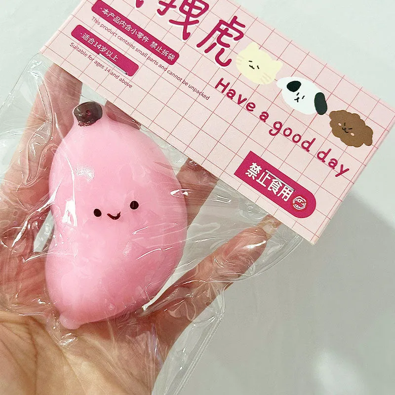 Chubby banana squeezing toy in pink TPR material for stress relief