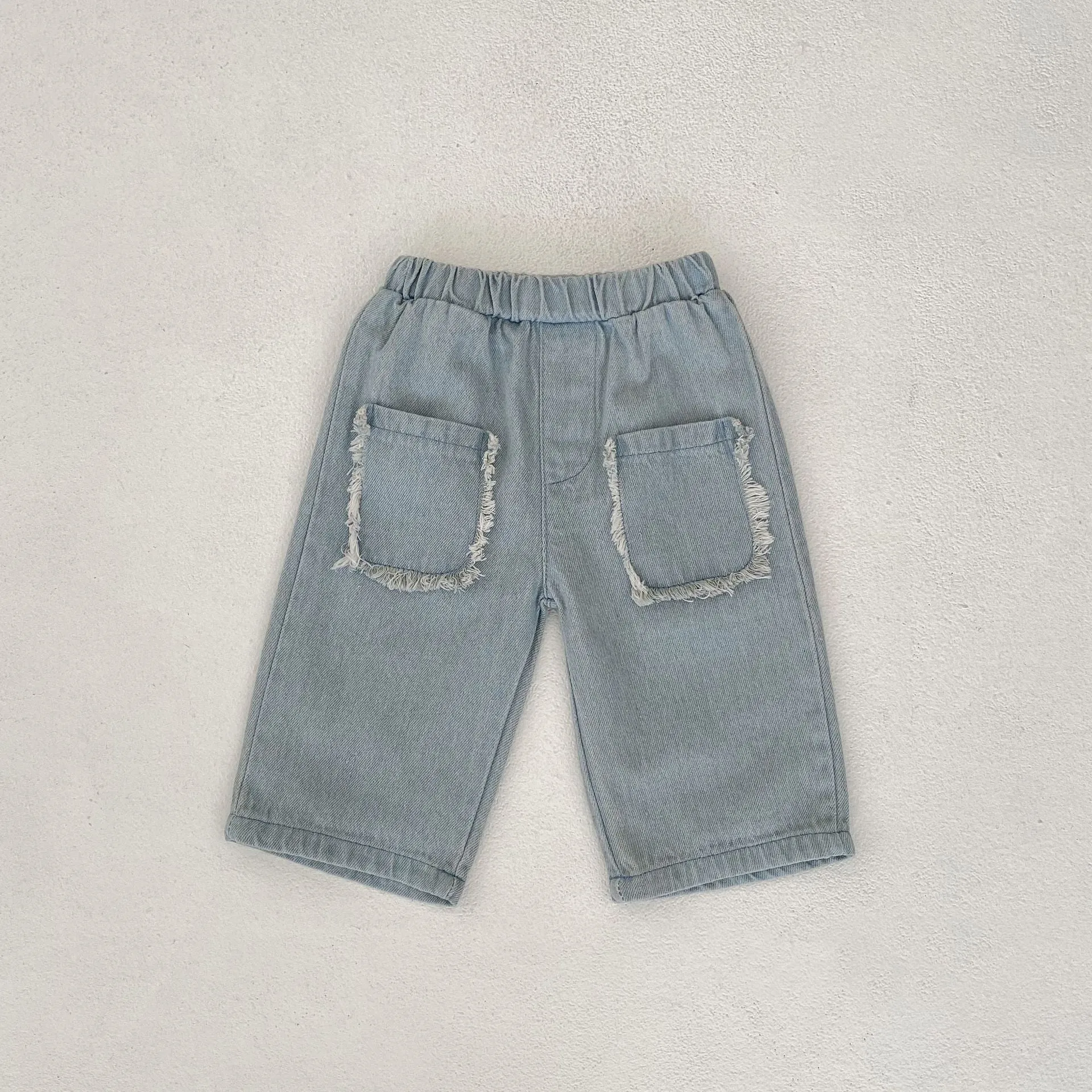 Children's cotton denim cropped pants in denim colour with burrs pocket and hairband belt