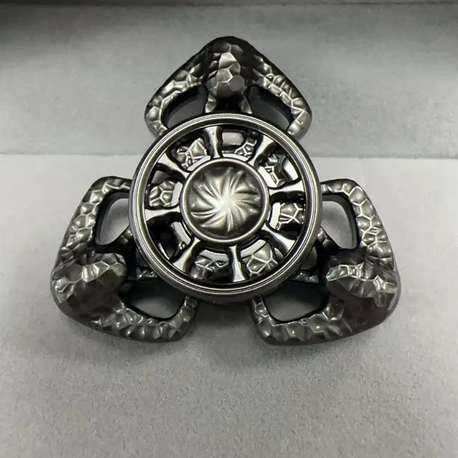 Flame Butterfly alloy metal rotating fingertip fidget gyro toy in colourful or space grey.