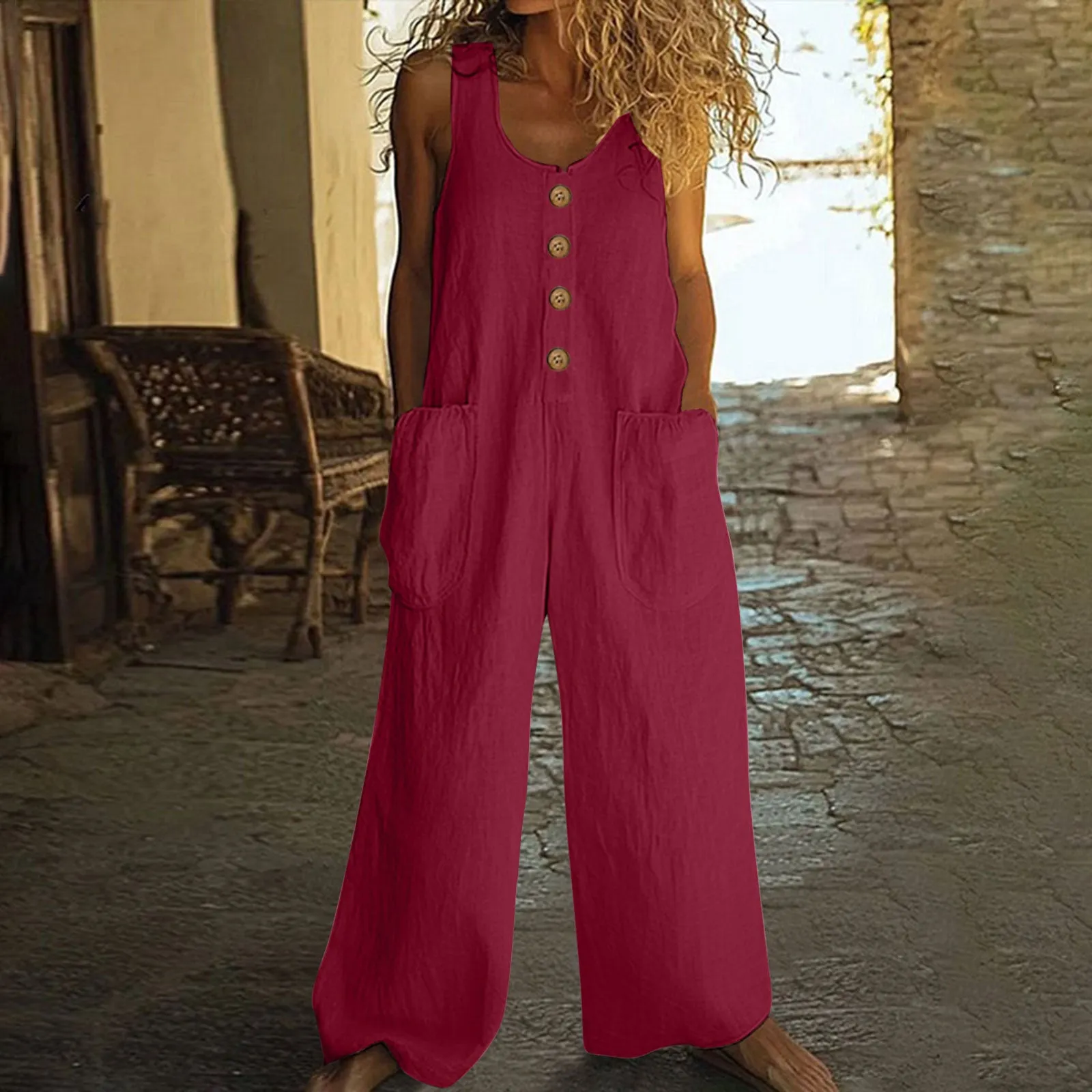 A sleeveless wide-leg cotton jumpsuit in an art retro style, shown in Army Green colour with a pocket and elasticated waist.