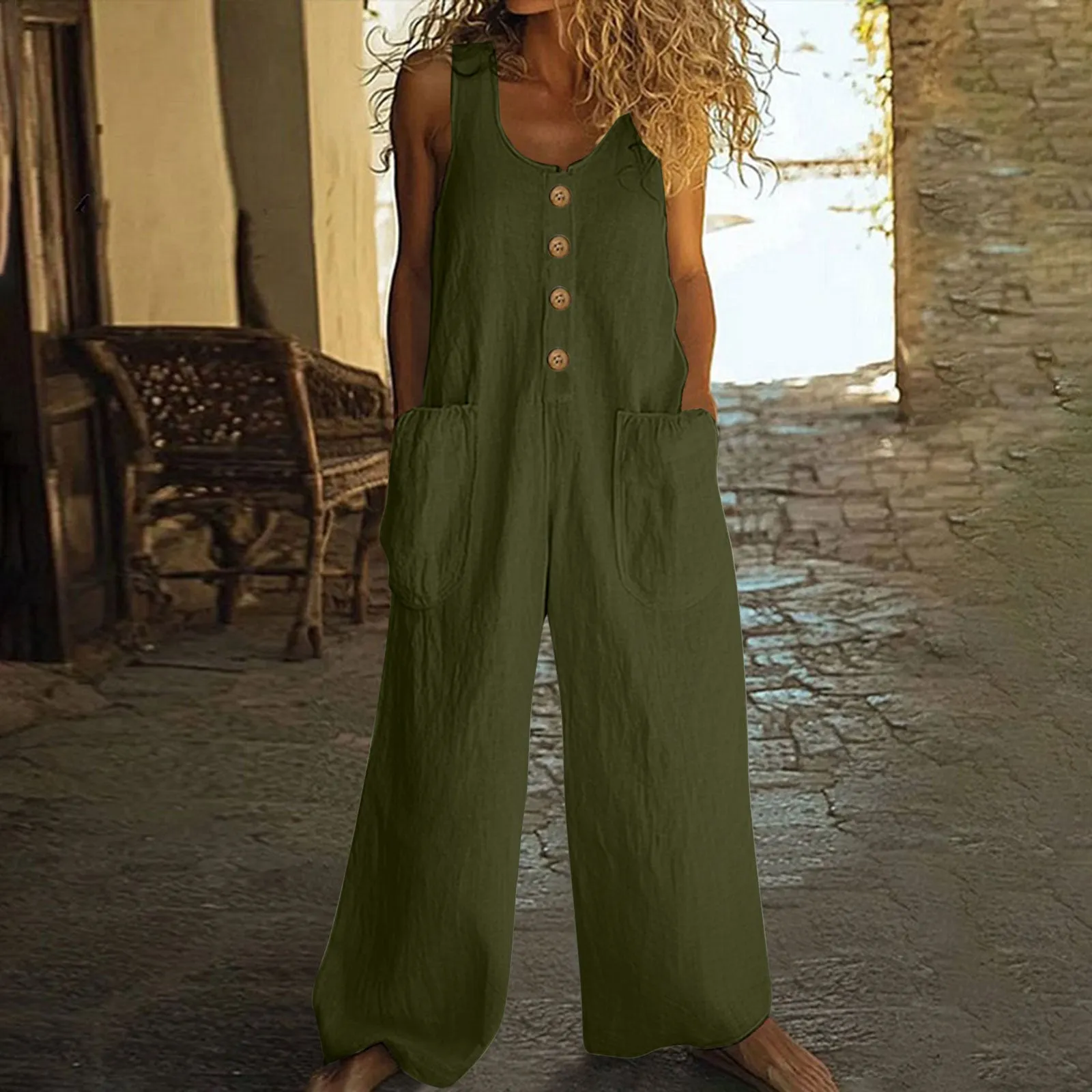 A sleeveless wide-leg cotton jumpsuit in an art retro style, shown in Army Green colour with a pocket and elasticated waist.