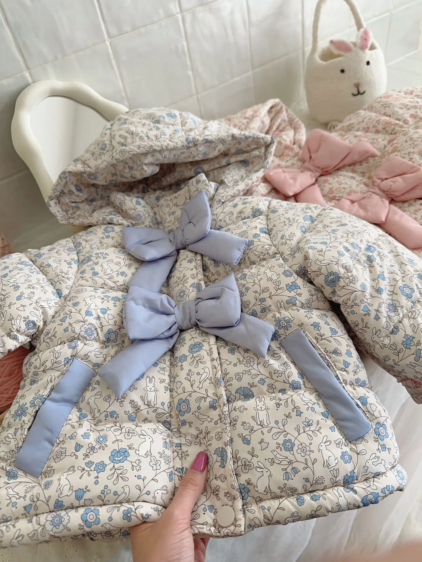 Baby girls winter floral print hooded jacket in blue and white porcelain blue with bow detail, zip-up front