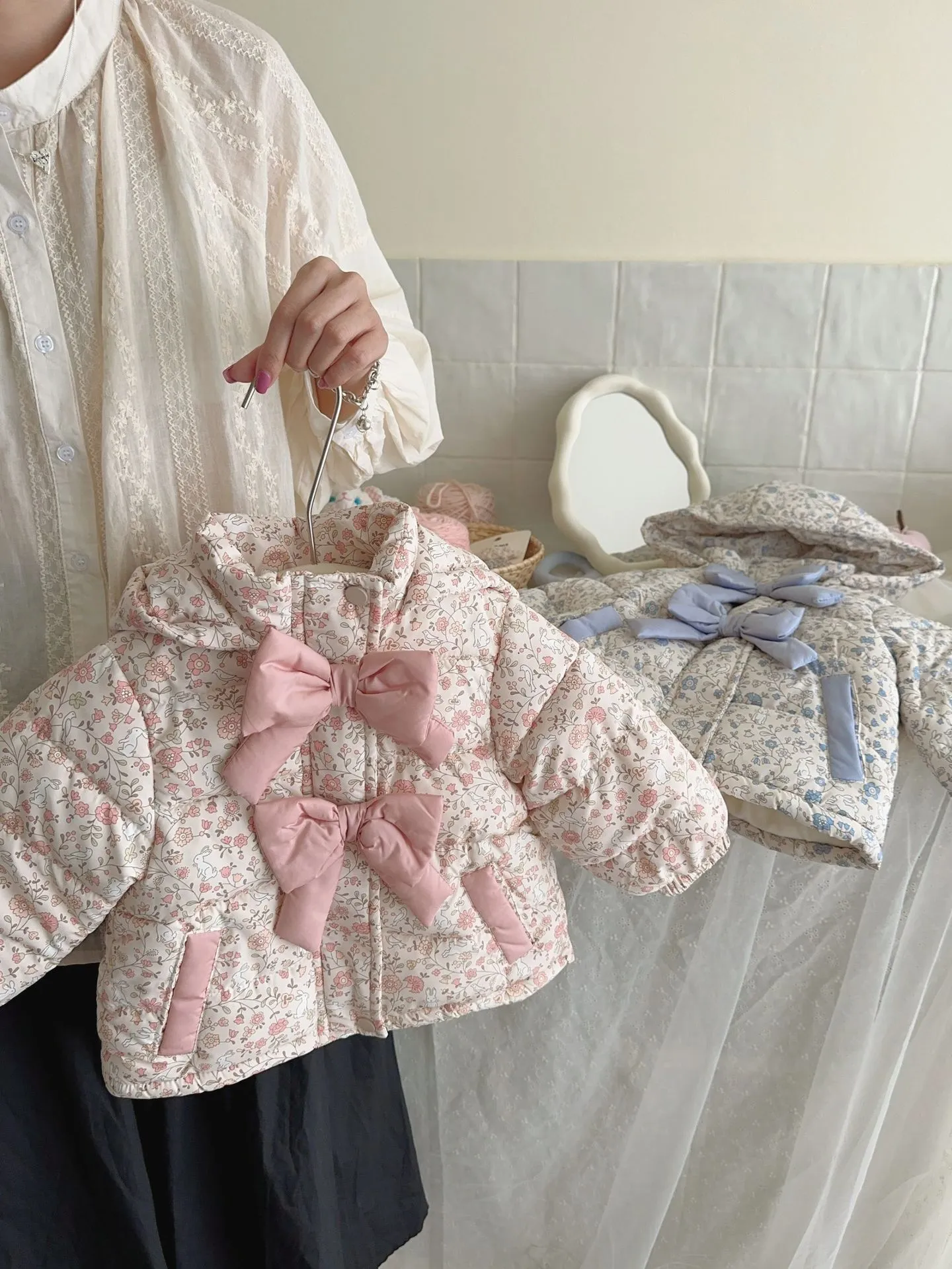 Baby girls winter floral print hooded jacket in blue and white porcelain blue with bow detail, zip-up front