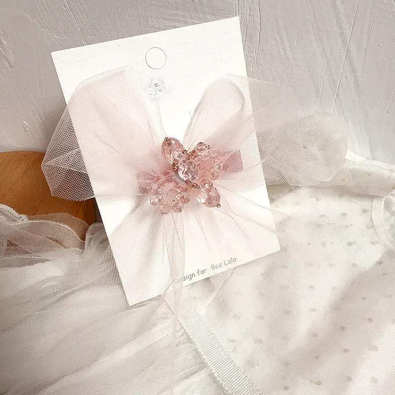 Children's press clip hair accessories set with cloth bows, sequins, pearls, and crystal flowers in pink and beige