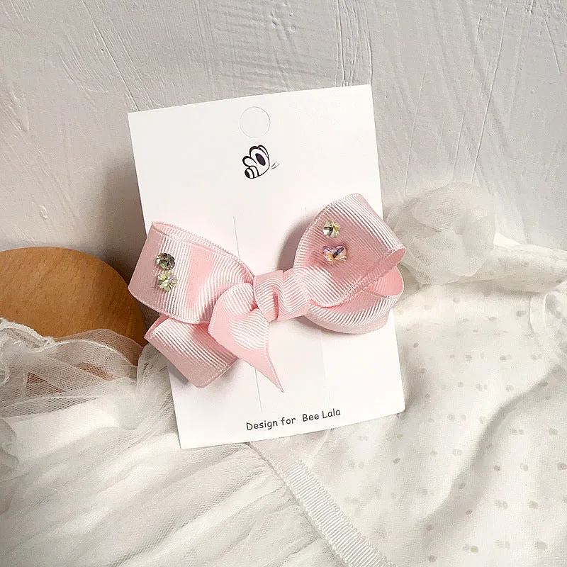 Children's press clip hair accessories set with cloth bows, sequins, pearls, and crystal flowers in pink and beige