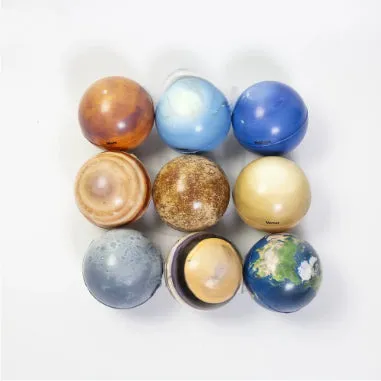 Set of eight solar system planet stress balls plus moon and sun in soft PU foam on white background