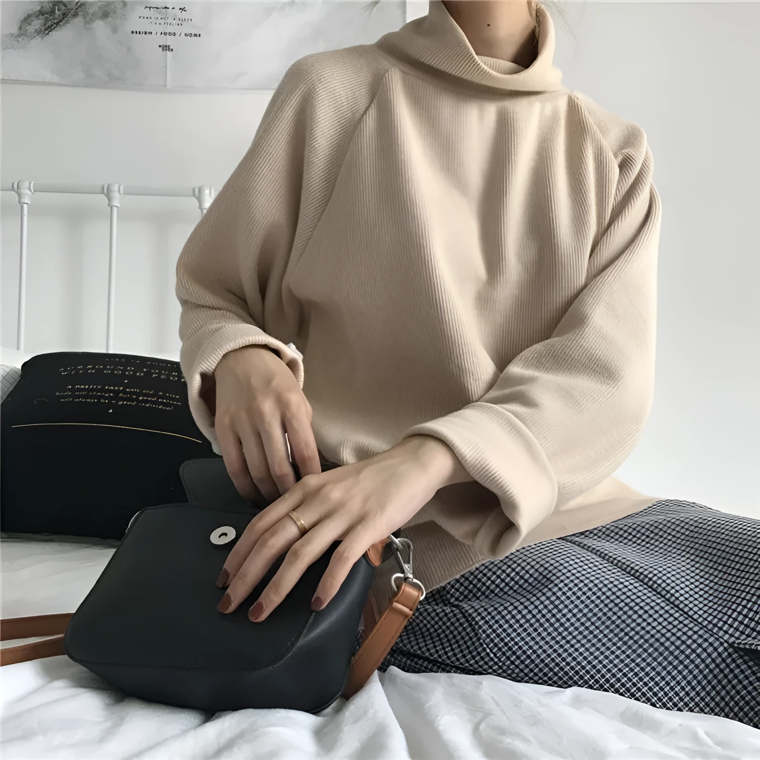 Women's loose-fitting long-sleeve top with a half-high collar in a solid colour.