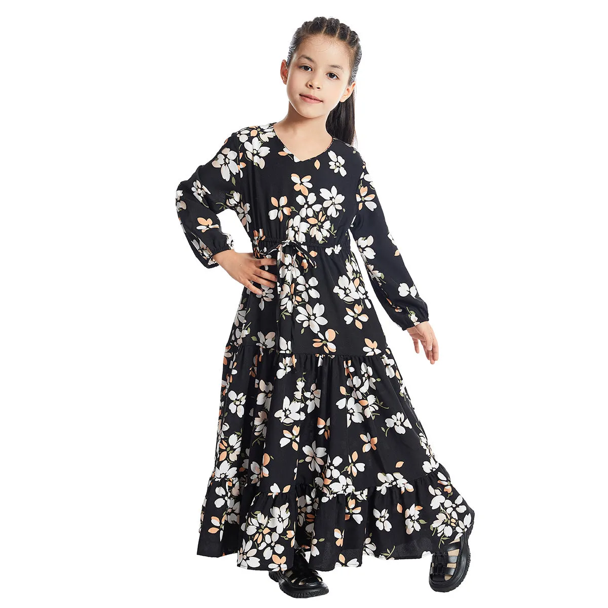 Girl wearing a long sleeve floral polyester dress with a flounced skirt in beige, available in heights 100-160cm