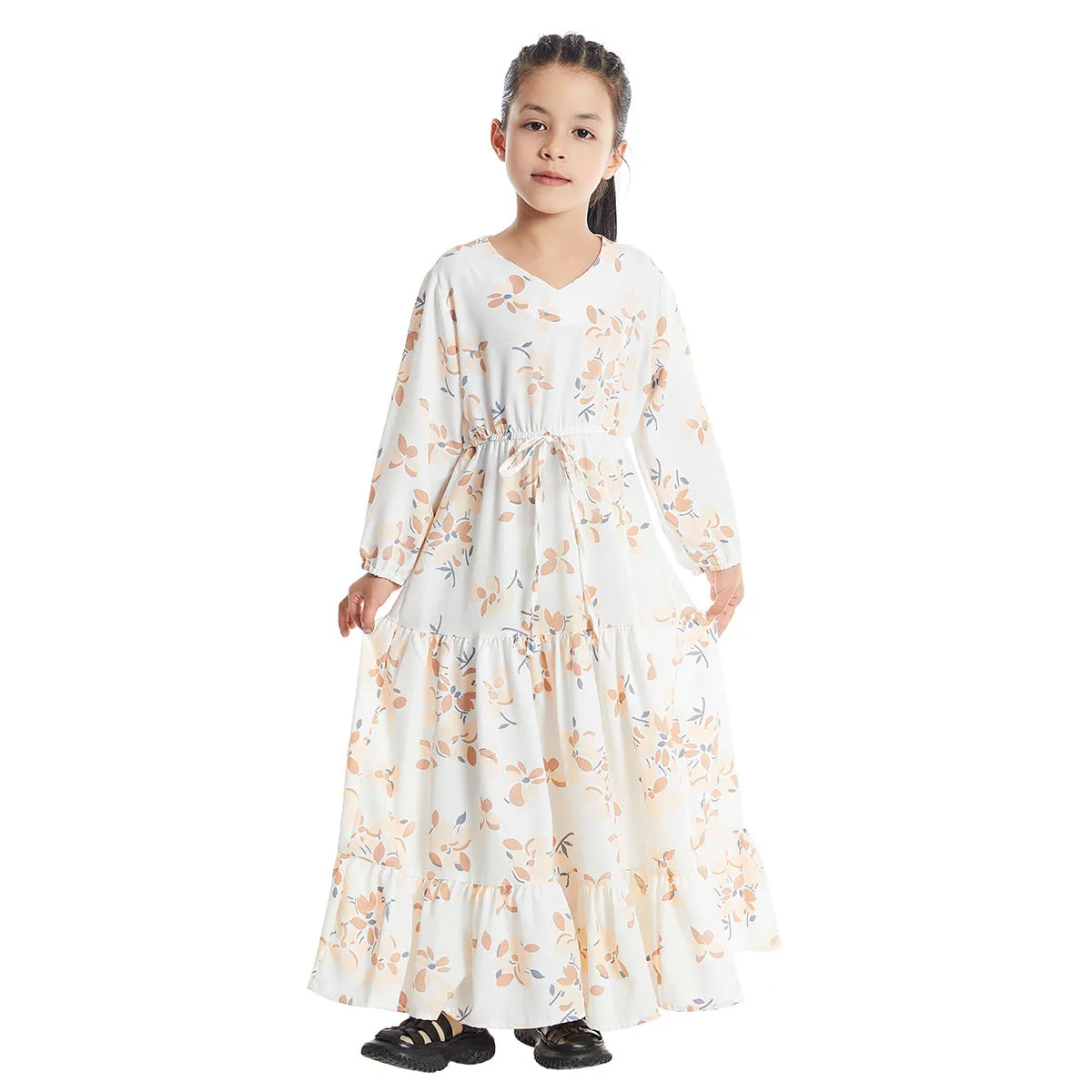 Girl wearing a long sleeve floral polyester dress with a flounced skirt in beige, available in heights 100-160cm