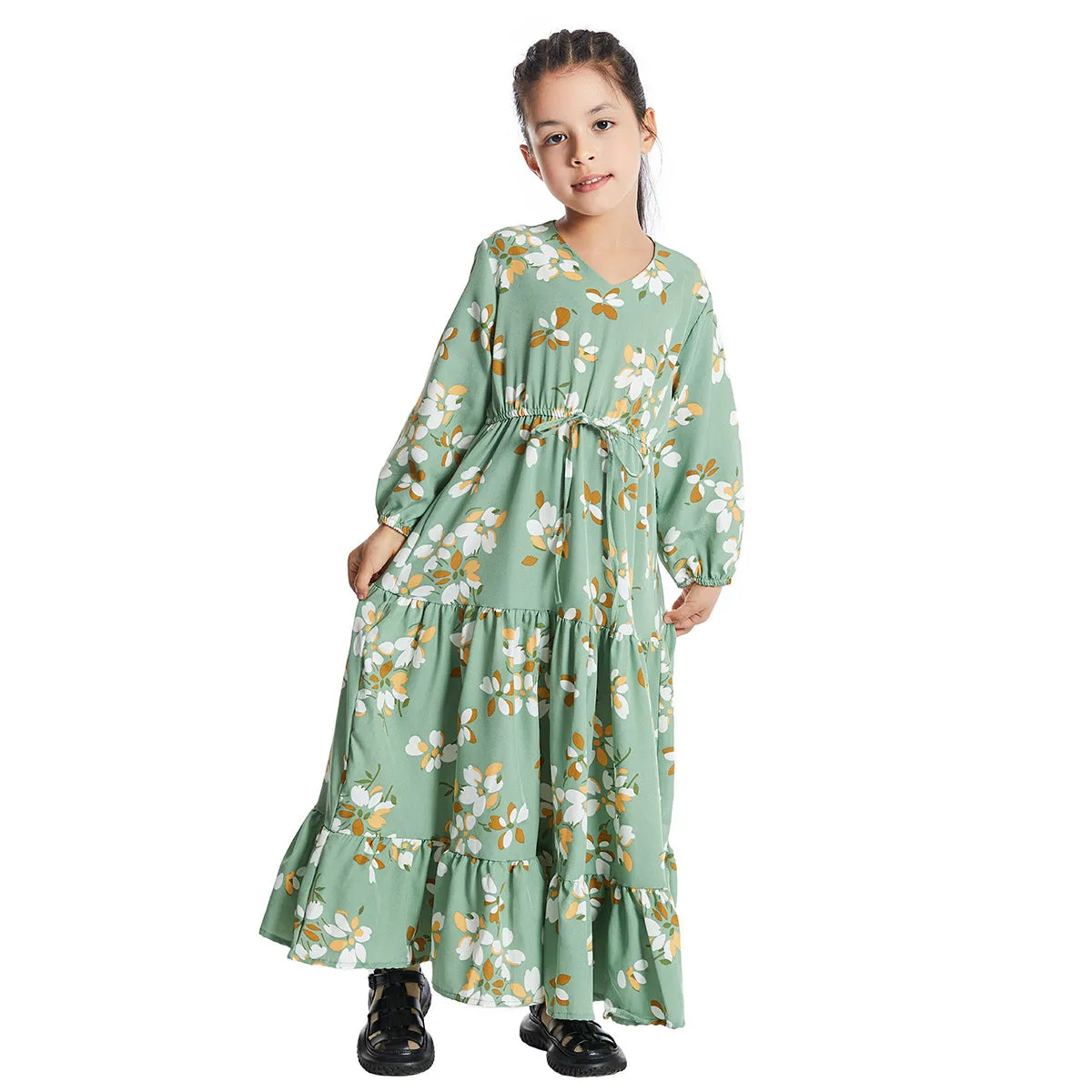 Girl wearing a long sleeve floral polyester dress with a flounced skirt in beige, available in heights 100-160cm