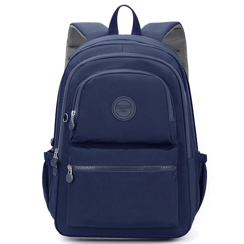 Women's nylon travel backpack in Azure Stone Green showing multiple compartments and organisational features