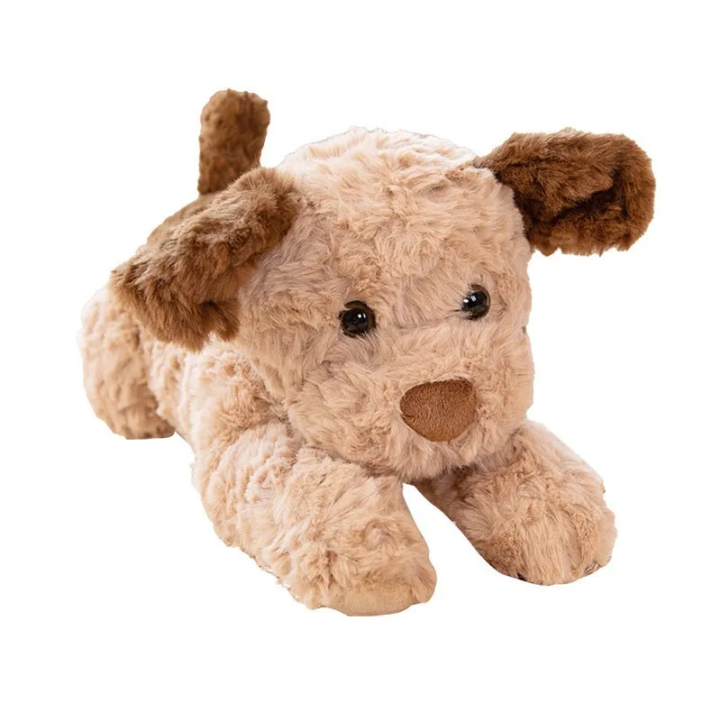 Plush toy lying dog doll in brown faux fur, 35cm height, lying on a soft surface
