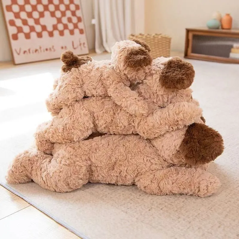 Plush toy lying dog doll in brown faux fur, 35cm height, lying on a soft surface