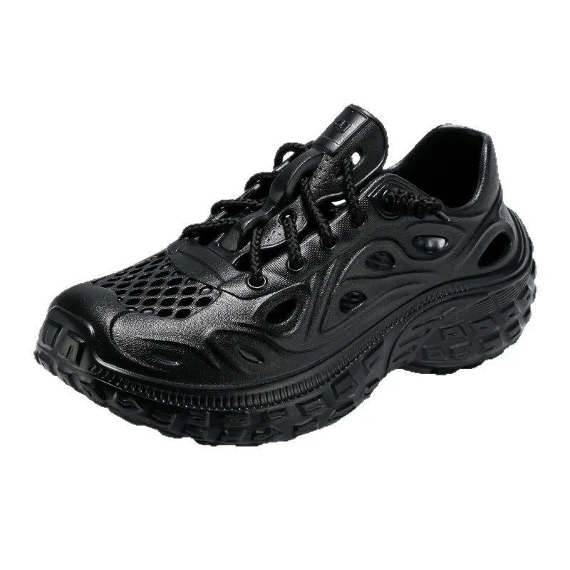 Men's black EVA sandals with a hollow out design and thick sole, shown on a foot.
