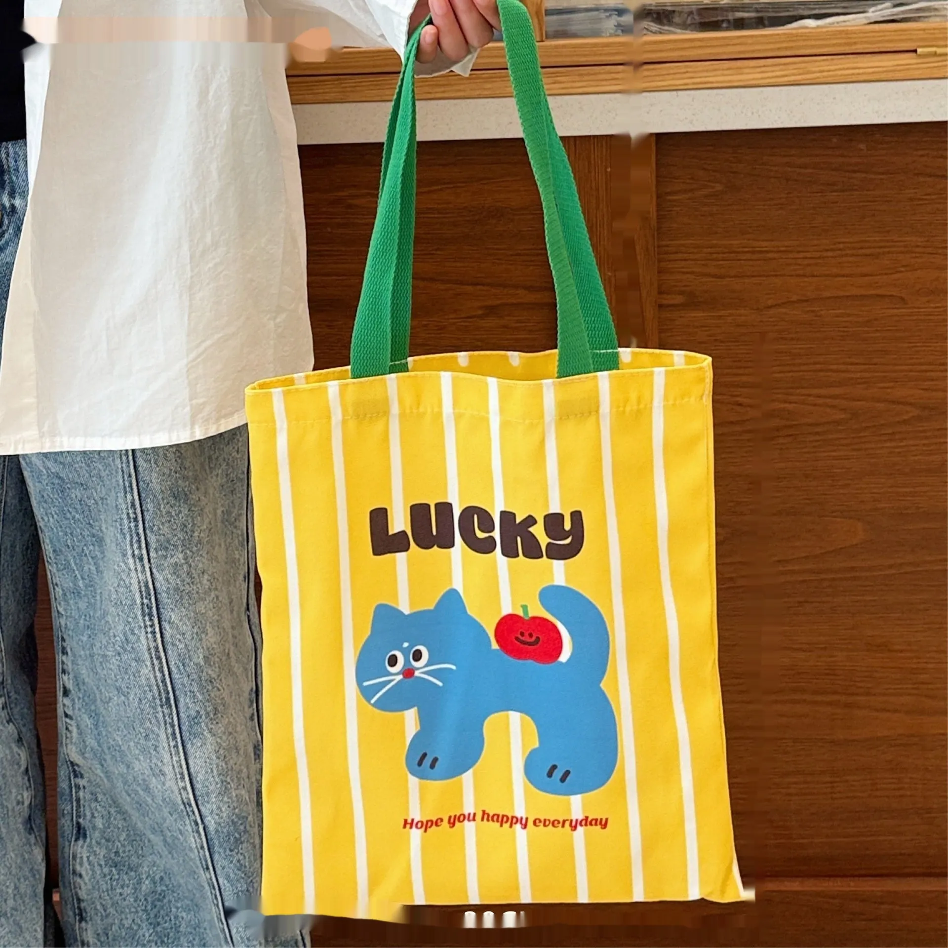Cartoon print canvas handbag with kitten design measuring 30cm wide by 36cm high