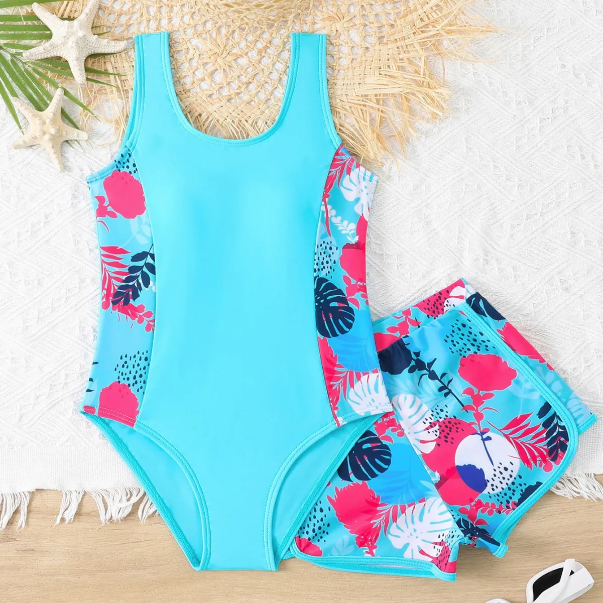 Girls two-piece swimsuit set with one-piece top and boxer shorts in purple, blue, and rose red