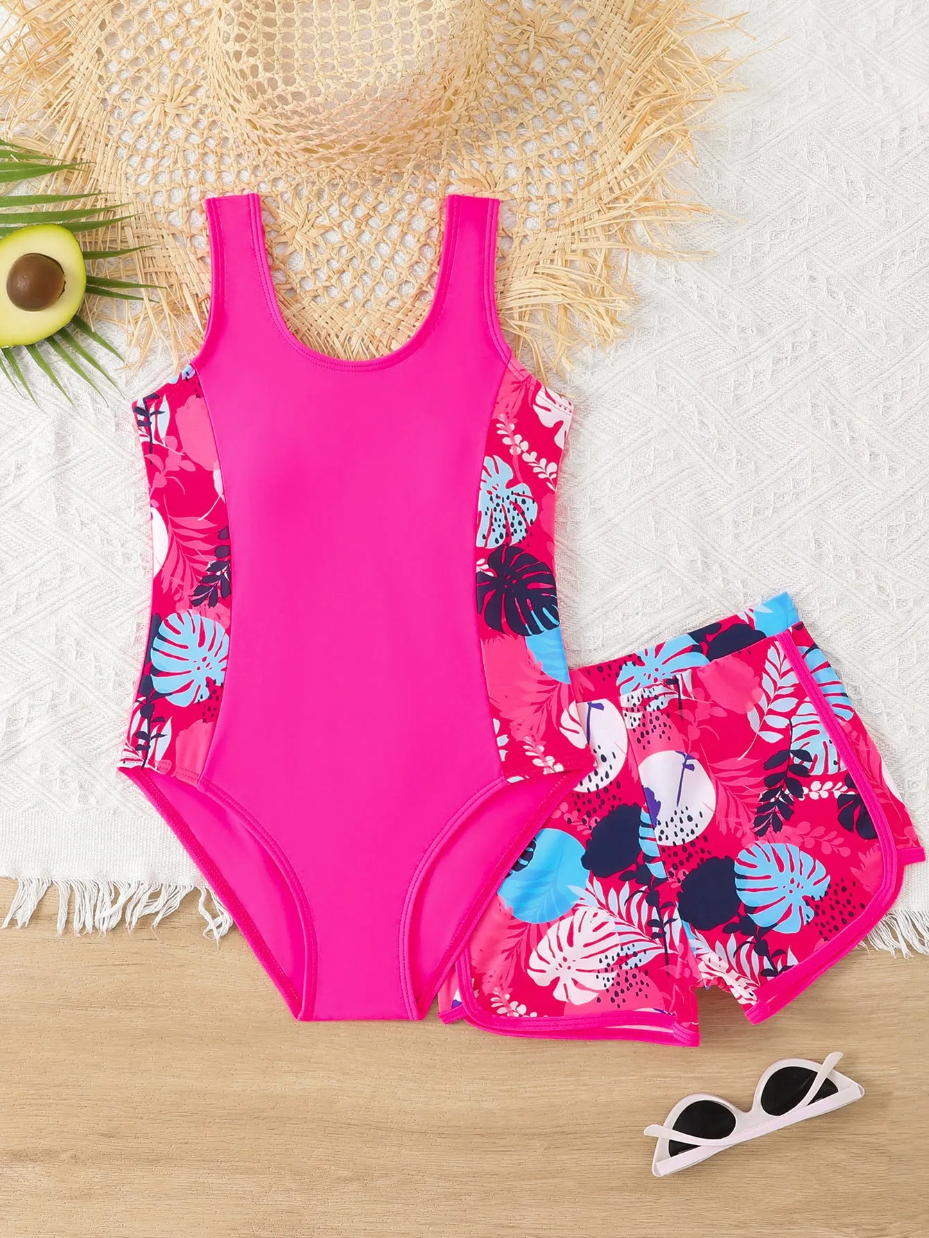 Girls two-piece swimsuit set with one-piece top and boxer shorts in purple, blue, and rose red