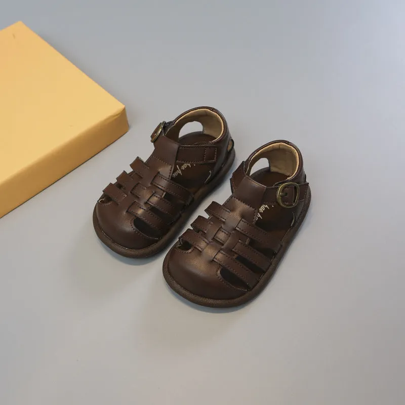 Girls' closed toe PU leather woven hollowed Roman sandals with Velcro strap, beige colour, on toddler feet