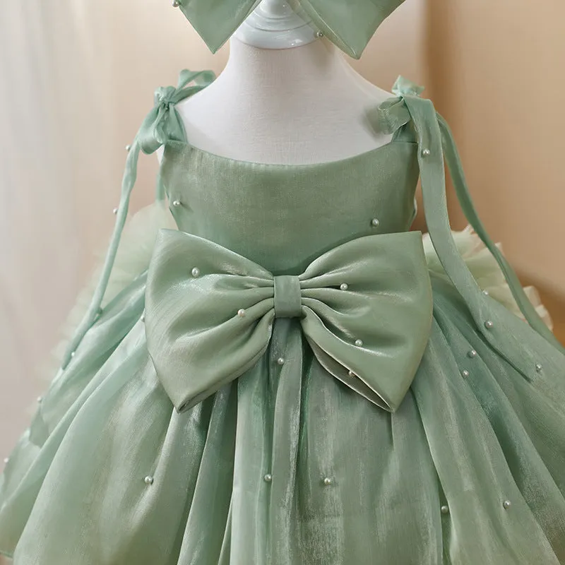Green large trailing mesh children's dress on display, suitable for heights 80cm to 160cm, polyester fibre construction.