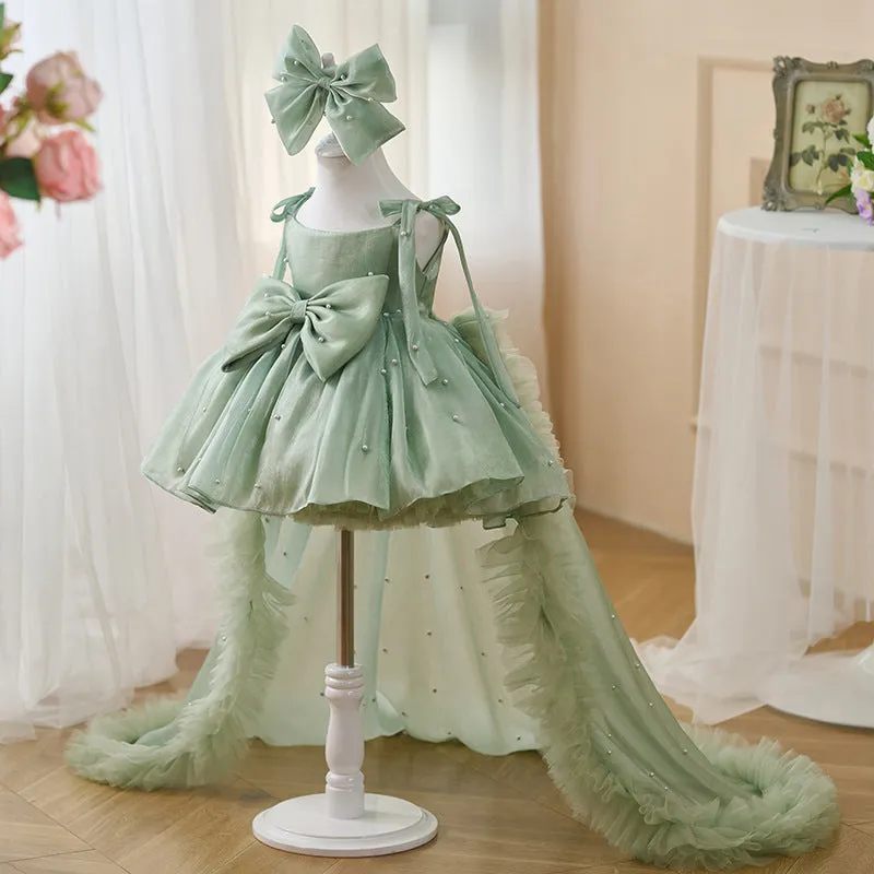 Green large trailing mesh children's dress on display, suitable for heights 80cm to 160cm, polyester fibre construction.